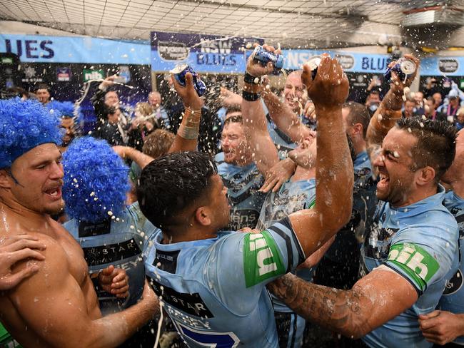 Blues players celebrate in the change rooms following their win over the Maroons in Game 2 of the 2018 State of Origin series between the NSW Blues and the Queensland Maroons at ANZ Stadium in Sydney, Sunday, June 24, 2018. (AAP Image/Dan Himbrechts) NO ARCHIVING, EDITORIAL USE ONLY