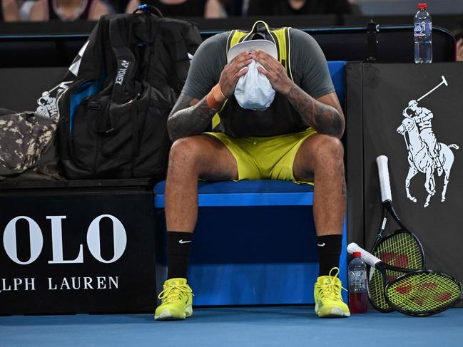 Australia's Nick Kyrgios puts his head in his hands during the round one match. Picture: William West/AFP.