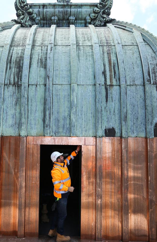 Christian Spencer-White inspects the work at Flinders St station. Picture: Tim Carrafa