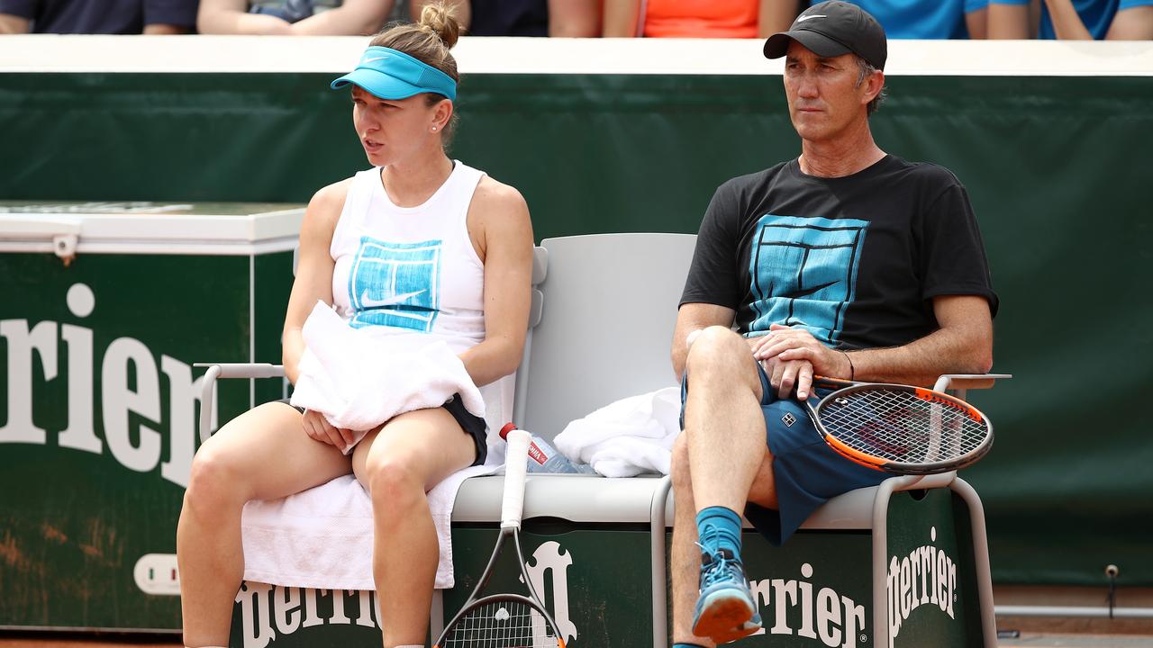 Simona Halep of Romania and coach Darren Cahill take a break during a practice session ahead of the 2018 French Open. Picture: Getty Images