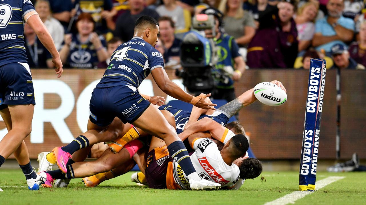 Kyle Feldt reaches out from a pile of bodies close to the try line. Picture: Alix Sweeney