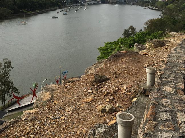 Police at the scene where a body was found at the base of the Kangaroo Point Cliffs.