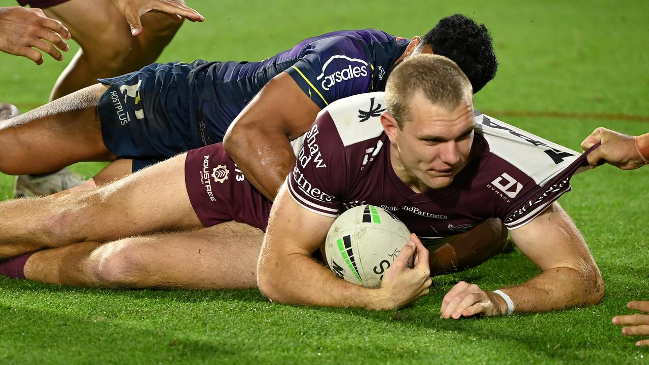 Tom Trbojevic man-handled by the Storm. Picture: NRL Photos