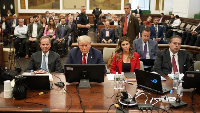 Donald Trump flanked by his legal team in court. Picture: AFP