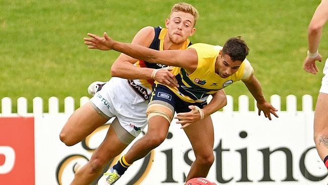 Adelaide's Hugh Greenwood and Eagles' Jared Petrenko compete for the ball at Woodville Oval. Picture: Tom Huntley