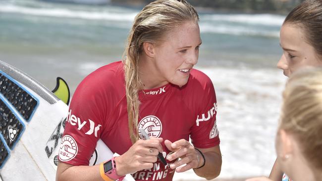 Laura Enever, who has been awarded the wildcard at her home break, signing autographs.