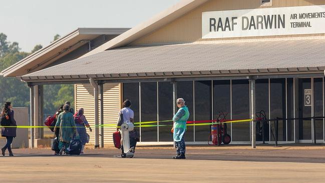 Passengers from the first repatriation flight into Australia from India since flights resumed disembark at RAAF Base Darwin destined for the Howard Springs quarantine facility. Picture: Supplied