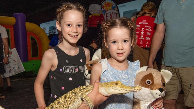 Rubi and Indi handling the crocodile. Picture: Pema Tamang Pakhrin