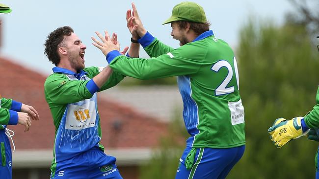 Lachlan Wilkins celebrates a wicket with East Sunbury teammates. Picture: Hamish Blair