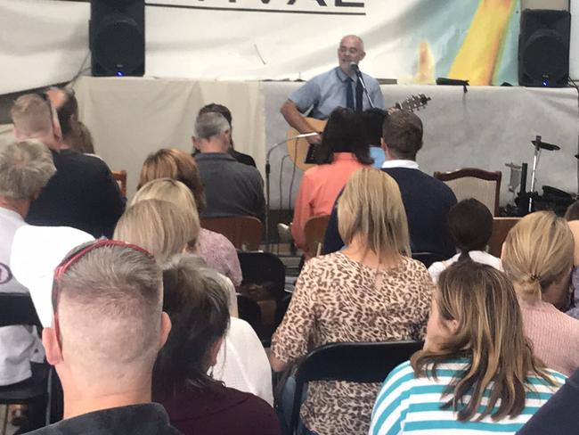 The Revival Church pastor Paul Furlong sings to parishioners during a service in Narre Warren in breach of lockdown restrictions on Sunday. Picture: Twitter/@tdolling