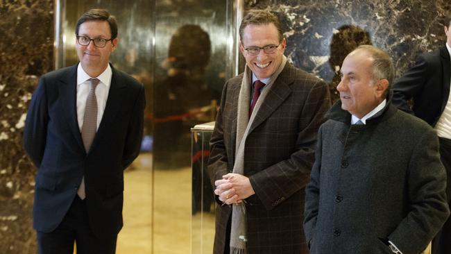 Executives from BHP Billiton Geoff Healy, from left, Andrew Mackenzie, and Jack Nasser stand in the lobby of Trump Tower in New York, before meeting with President-elect Donald Trump. Picture: AP.