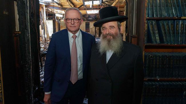 Anthony Albanese with Rabbi Shlomo Kohn at the torched Adass Israel Synagogue in Melbourne.