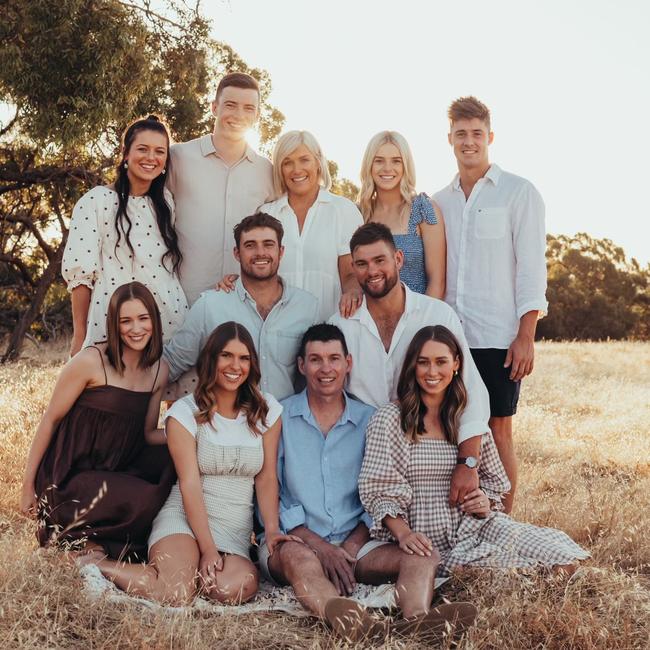 Devoted family man Chris Grigg is pictured with his family. From back, Tash, Tom, wife Samantha, Riley, Lucy, Ryan, Mitch, Maddy, (Chris) and Nicole. Picture supplied.