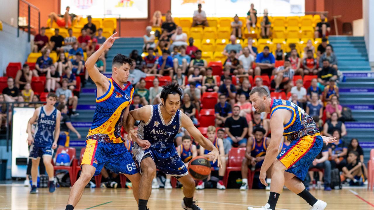 Henry Bui with a spin move in the paint to the basket. Darwin Basketball Men's Championship Round 20: Ansett v Tracy Village Jets. Picture: Che Chorley