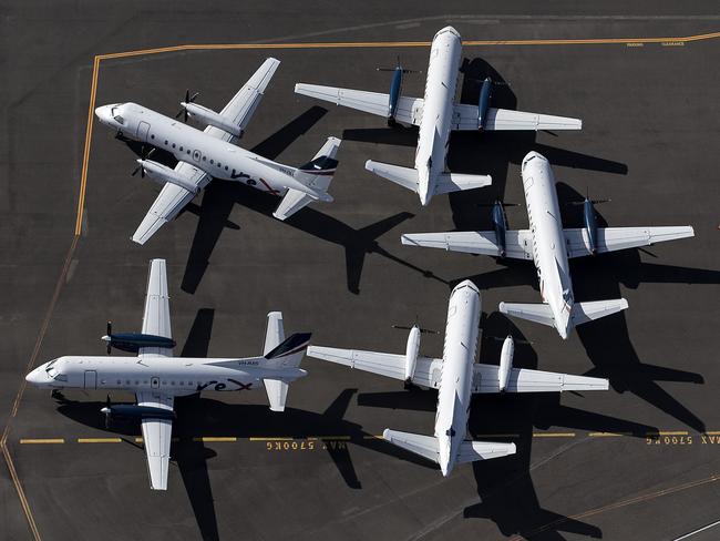 SYDNEY, AUSTRALIA - APRIL 22: An aerial view of Rex Airlines aircraft at Sydney Airport on April 22, 2020 in Sydney, Australia. Restrictions have been placed on all non-essential business and strict social distancing rules are in place across Australia in response to the COVID-19 pandemic.  (Photo by Ryan Pierse/Getty Images)