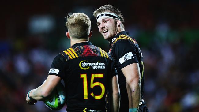 Damian McKenzie of the Chiefs celebrates with Sam Cane after scoring a try.