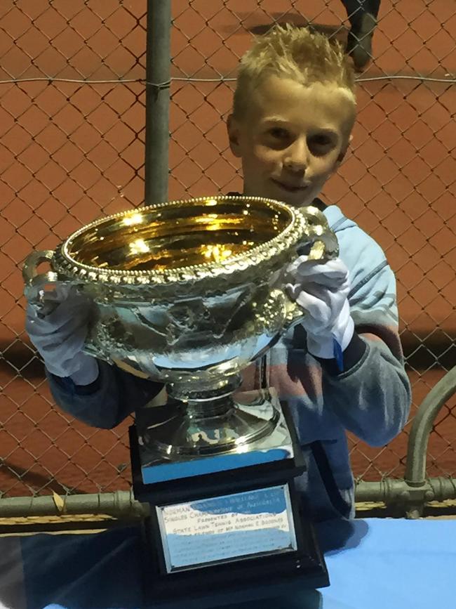 Jai gets his hands on the Australian Open trophy in 2015. Picture: Tea Tree Gully Tennis Club