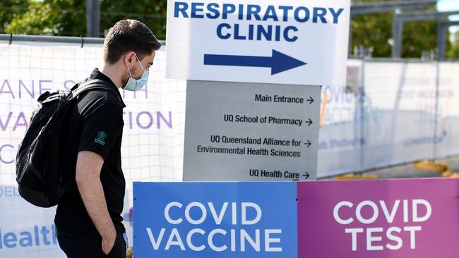 A masked man outside a Covid-19 vaccine and testing clinic in Brisbane. Picture: NCA NewsWire / Dan Peled