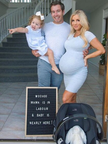 Hannah Polites, Grant Small and daughter Evaliah making the announcement Mrs Polites had gone into labour.