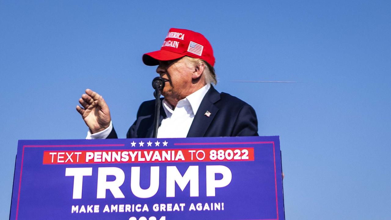 One image captured by Doug Mills from the New York Times shows what appears to be a bullet passing by Trump’s head. Picture: Doug Mills/New York Times/Headpress