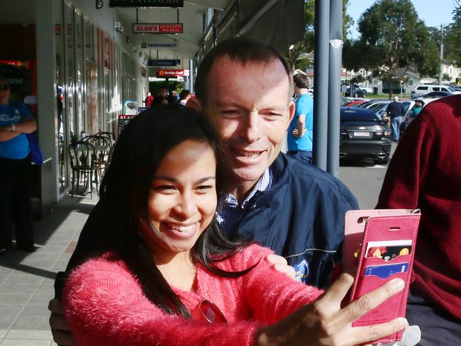 Jessica Campbell, visiting from Cairns, takes a selfie with Tony Abbott, Member for Warringah and former Prime Minister, at Lisarow shopping centre, ahead of the upcoming federal election. Picture: Peter Clark.