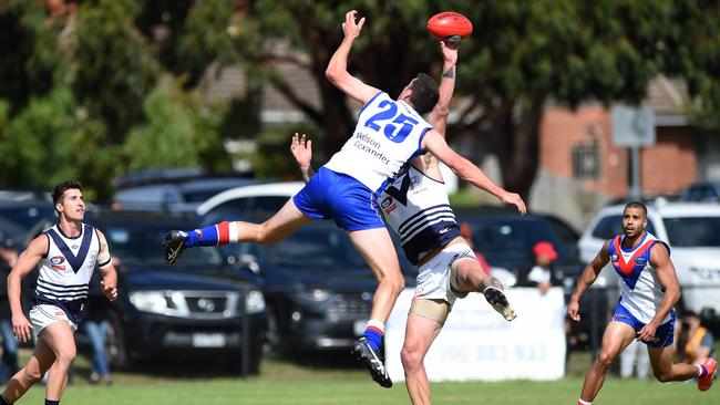 Hamish Shepheard wins the tap against Matthew Harman. Picture: Steve Tanner