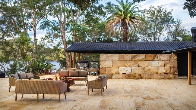 Terrace seating with firepit at Marramarra Lodge.