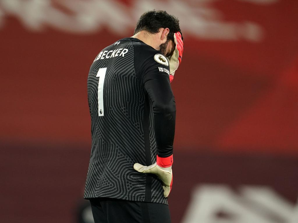 Liverpool's Brazilian goalkeeper Alisson Becker reacts after conceding their third goal. (Photo by Jon Super / POOL / AFP)