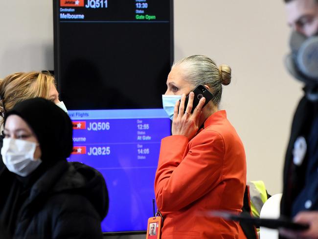 A Jetstar staff member is seen wearing a face mask at Sydney Airport yesterday. Picture: NCA NewsWire / Bianca De Marchi