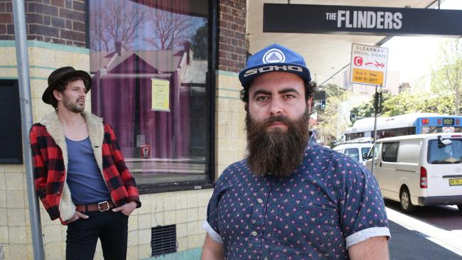 (L-R) Leroy Lee and Joe Gould formed The Lock Outlaws band to protest the Baird Government's lockout laws. They are standing outside the Flinders, one of Sydney’s closed pubs. Picture: Craig Wilson