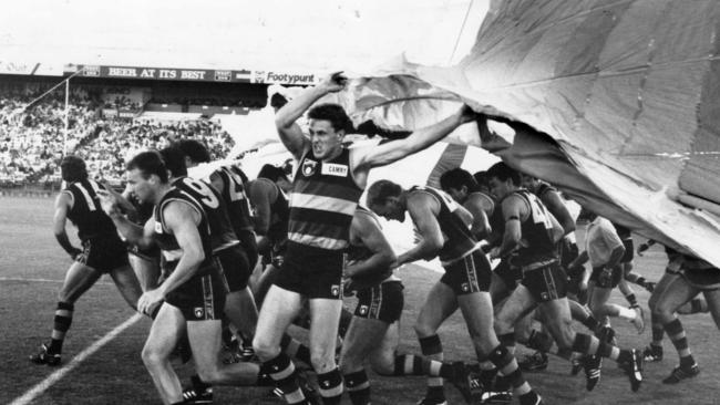 Adelaide players run out before their first trial game against Essendon at Football Park in 1991. Picture: Neon Martin