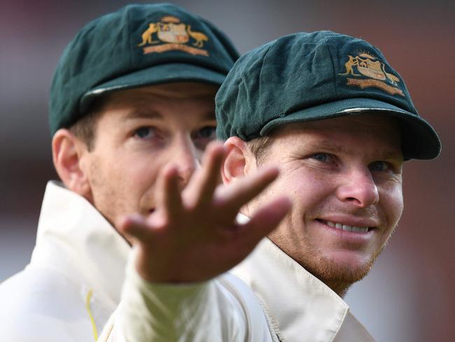 Australia's captain Tim Paine (L) and Australia's Steve Smith (R) celebrate their victory on the field after the fourth Ashes cricket Test match between England and Australia at Old Trafford in Manchester, north-west England on September 8, 2019. - Australia retained the Ashes with a 185-run thrashing of England in the fourth Test at Old Trafford on Sunday. (Photo by Oli SCARFF / AFP) / RESTRICTED TO EDITORIAL USE. NO ASSOCIATION WITH DIRECT COMPETITOR OF SPONSOR, PARTNER, OR SUPPLIER OF THE ECB