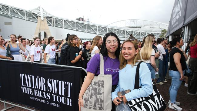 Taylor Swift fans Thea Belmonte and Shaznee Villaruz lined up for one hour to get merchandise before the next concert, at the Homebush Stadium in Sydney. Picture: NCA NewsWire / Gaye Gerard