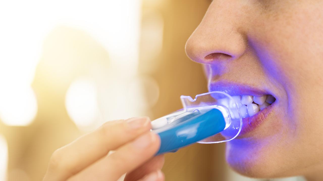 LED light may have some minor whitening benefits by activating the whitening agents in certain products. Picture: iStock