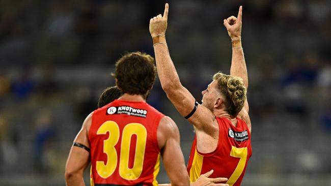 Nick Holman of the Suns celebrates a goal during the Round 1. Picture: Daniel Carson/AFL Photos via Getty Images