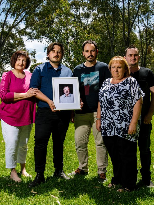 The family of Peter Howard – Carmel Schwartz, Jacob, Cameron, Sharon and Nathan Howard with a framed photo of Mr Howard. Picture: The Advertiser / Morgan Sette