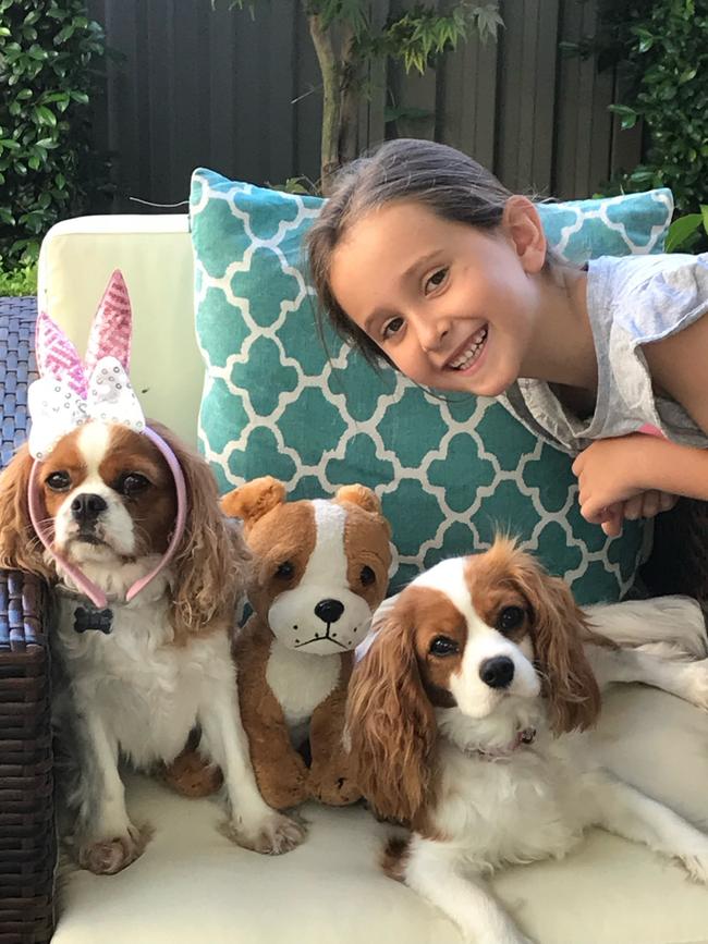 Ava with her dogs Lucy and Betty. Picture: Supplied by family