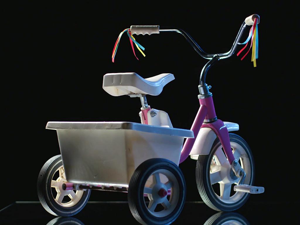 The tricycle is the perfect motif for the colourful, horrifying JonBenet story. 