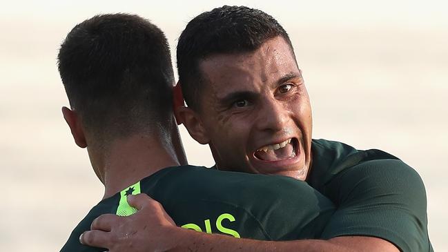 DUBAI, UNITED ARAB EMIRATES - DECEMBER 30:  Chris Ikonomidis and Andrew Nabbout of Australia celebrates their second goal during the International Friendly match between Australia and Oman at Maktoum Bin Rashid Al Maktoum Stadium on December 30, 2018 in Dubai, United Arab Emirates.  (Photo by Francois Nel/Getty Images)