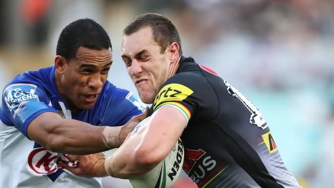 Penrith's Isaah Yeo makes a break to set up a try by Penrith's James Maloney during the Bulldogs v Penrith rugby league match at ANZ Stadium, Sydney. Picture: Brett Costello