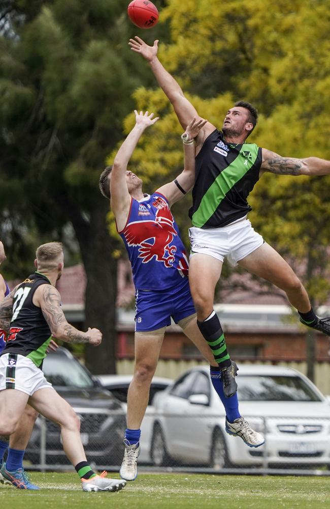 Doveton ruckman Dylan Chapman springs for a tap. Picture: Valeriu Campan