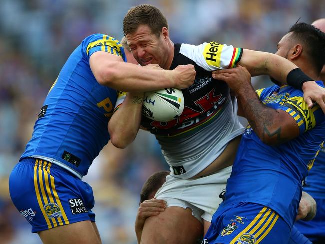 SYDNEY, AUSTRALIA - APRIL 22:  Trent Merrin of the Panthers is tackled during the round eight NRL match between the Parramatta Eels and the Penrith Panthers at ANZ Stadium on April 22, 2017 in Sydney, Australia.  (Photo by Matt Blyth/Getty Images)