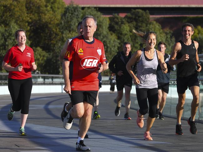 Australian Opposition Leader Bill Shorten is seen during a morning run with local supporters ahead of day two of the Labor Party National Conference in Adelaide, Monday, December 17, 2018.  Labor's 48th National Conference is being held from Sunday 16 to Tuesday 18 December 2018 at the Adelaide Convention Centre. (AAP Image/Lukas Coch) NO ARCHIVING