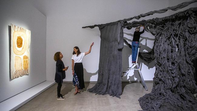 TarraWarra Biennial guest curator Nina Miall with artist Mandy Quadrio and her work <i>who's time are we on?</i>, 2021. Picture: Aaron Francis