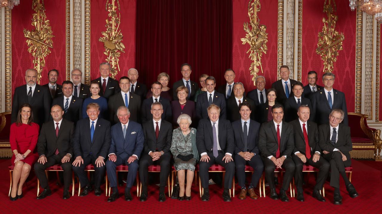 Leaders of NATO alliance countries, and its secretary general, join the Queen and Prince Charles for a group picture during a reception in Buckingham Palace. Picture: Yui Mok/Getty Images