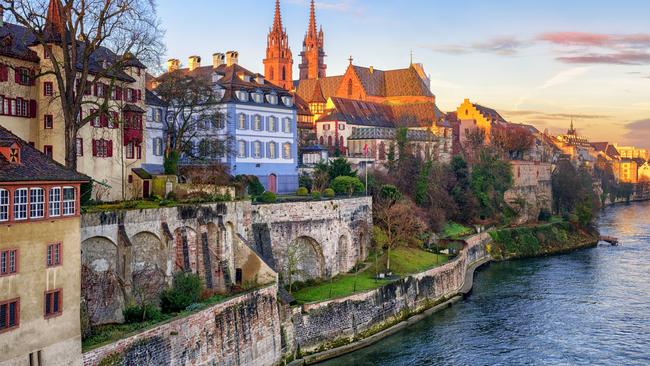 Old town of Basel with red stone Munster cathedral on the Rhine river, Switzerland.