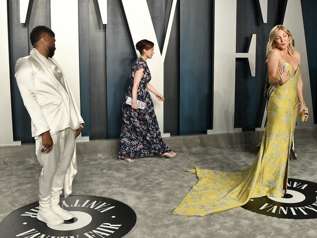 Usher and Kate Hudson walk the grey carpet at the Vanity Fair party. Picture: Frazer Harrison/Getty Images