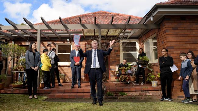 An auctioneer seeks to raise interest in a house in the Sydney suburb of East Lindfield. Picture: Tracey Nearmy