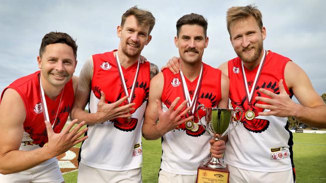 Brad Kirk (right) with (L-R) Daniel Butcher, Mitchell Fazekas and David Kearsley after the Falcons’ 2020 grand final win. Picture: Dean Martin