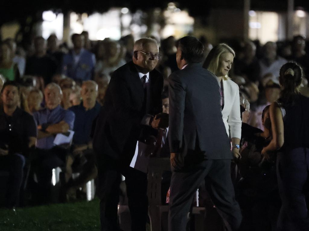 Scott Morrison shakes hands with Richard Marles at the Anzac Day dawn service at the Darwin Cenotaph War Memorial. Picture: Tim Hunter